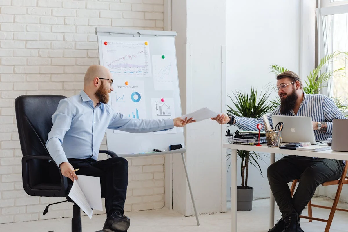 Professionals reviewing documents during a business meeting